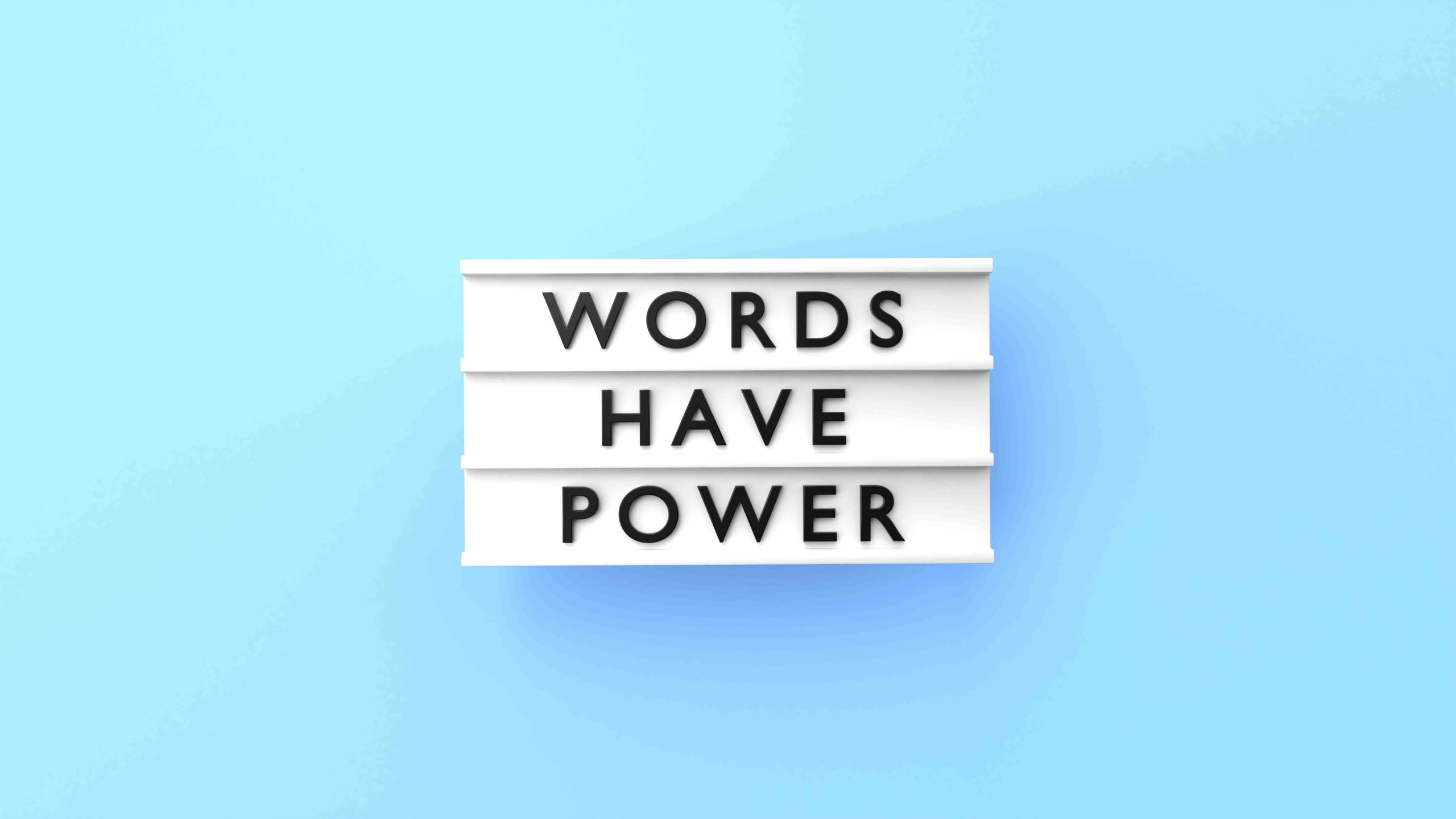Words Have Power Text is Displaying on a Lightbox on Blue Background