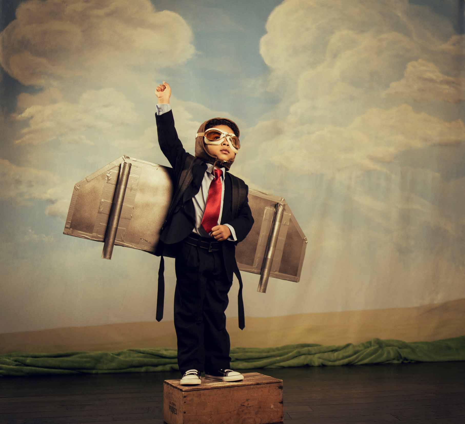Young Boy dressed as Businessman Wearing Jet Pack