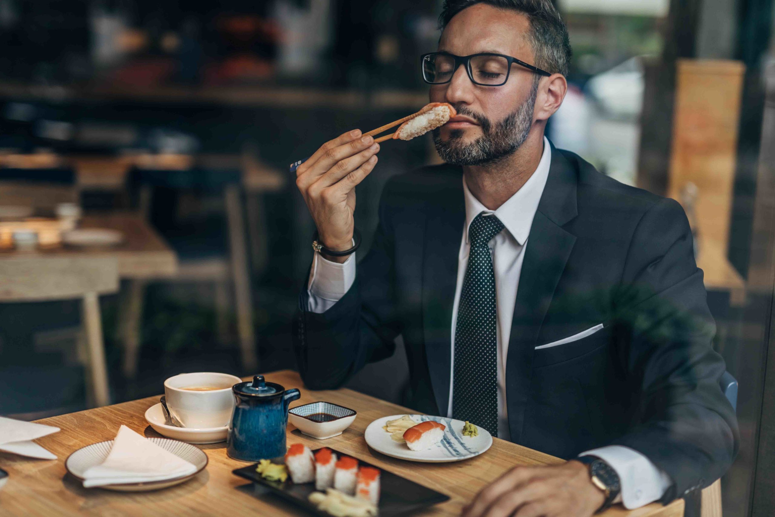 Man eating sushi in the restaurant